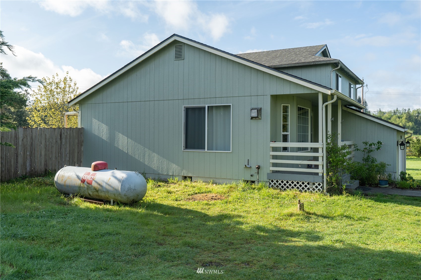 18726 Deerfield Lane Southwest Rochester, WA 98579 - Photo 7 of 27 a house with garden in front of it