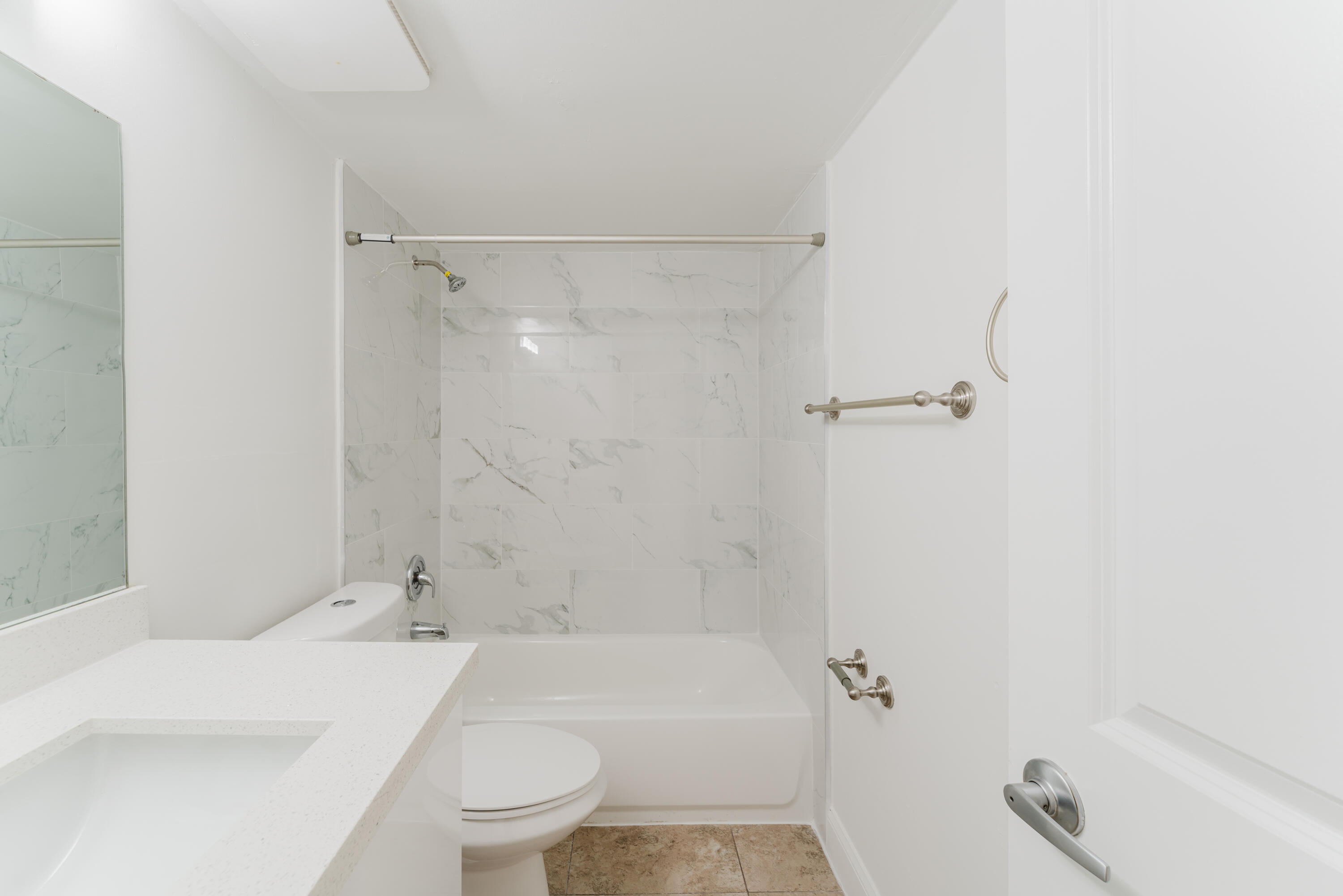 601 Southwest 2nd Avenue, Unit 5 Boca Raton, FL 33432 - Photo 16 of 26 a bathroom with a sink a toilet and shower