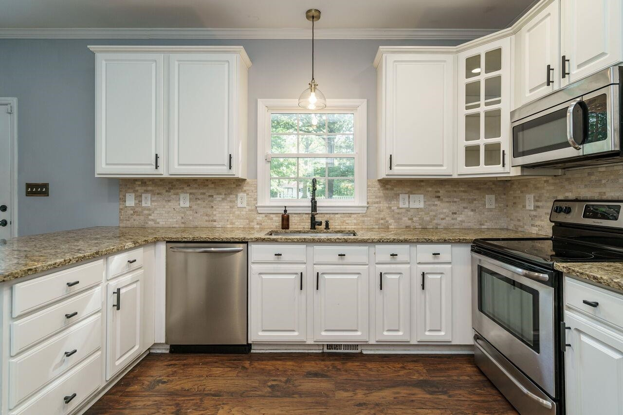 4202 Holt School Road Durham, NC 27704 - Photo 13 of 27 Whether you're a gourmet chef or simply enjoy preparing meals, this kitchen is sure to inspire your culinary creativity. Kitchen