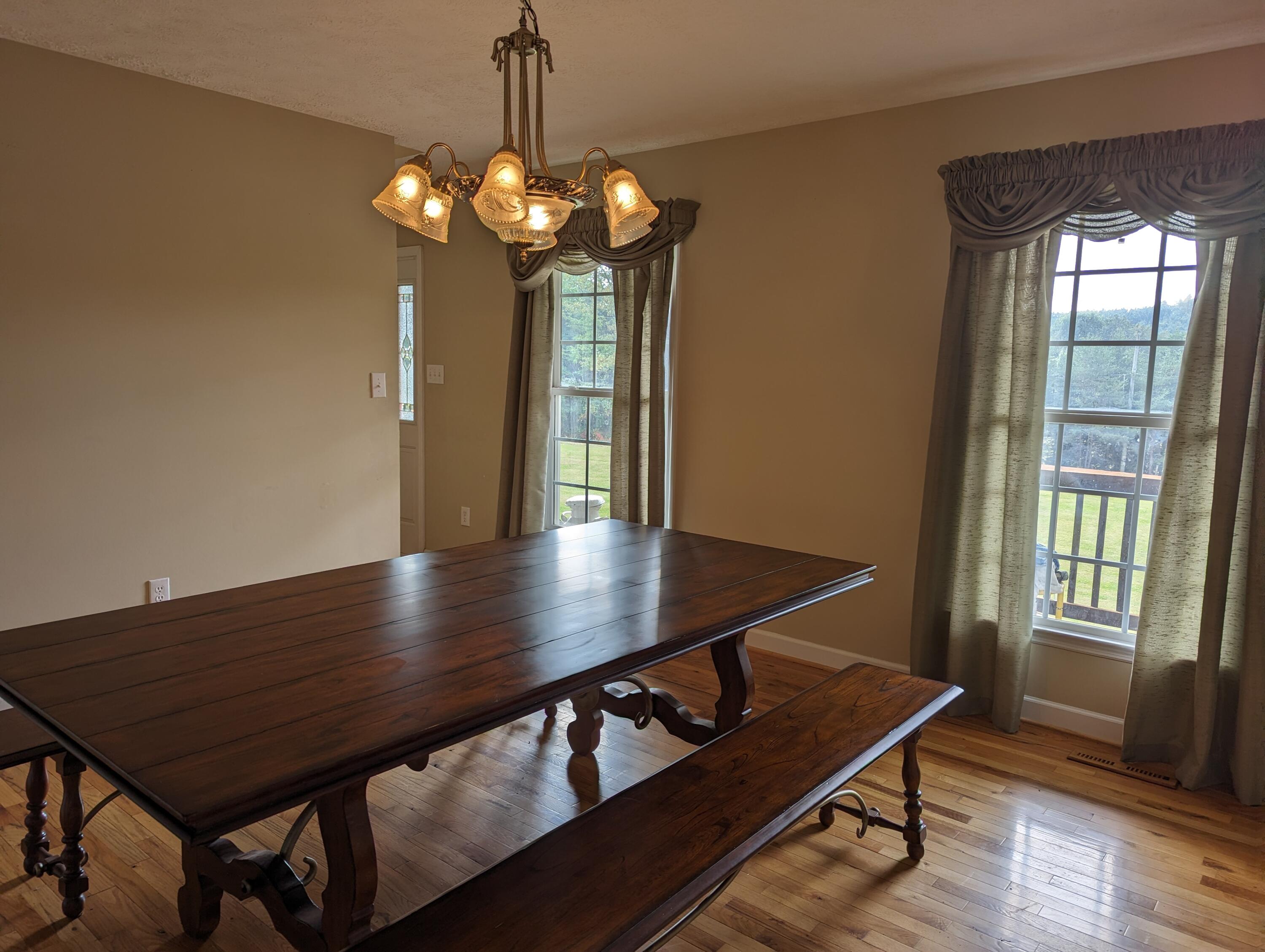 4715 Providence Church Road Ferrum, VA 24088 - Photo 12 of 46 a view of a room with a table chairs and wooden floor
