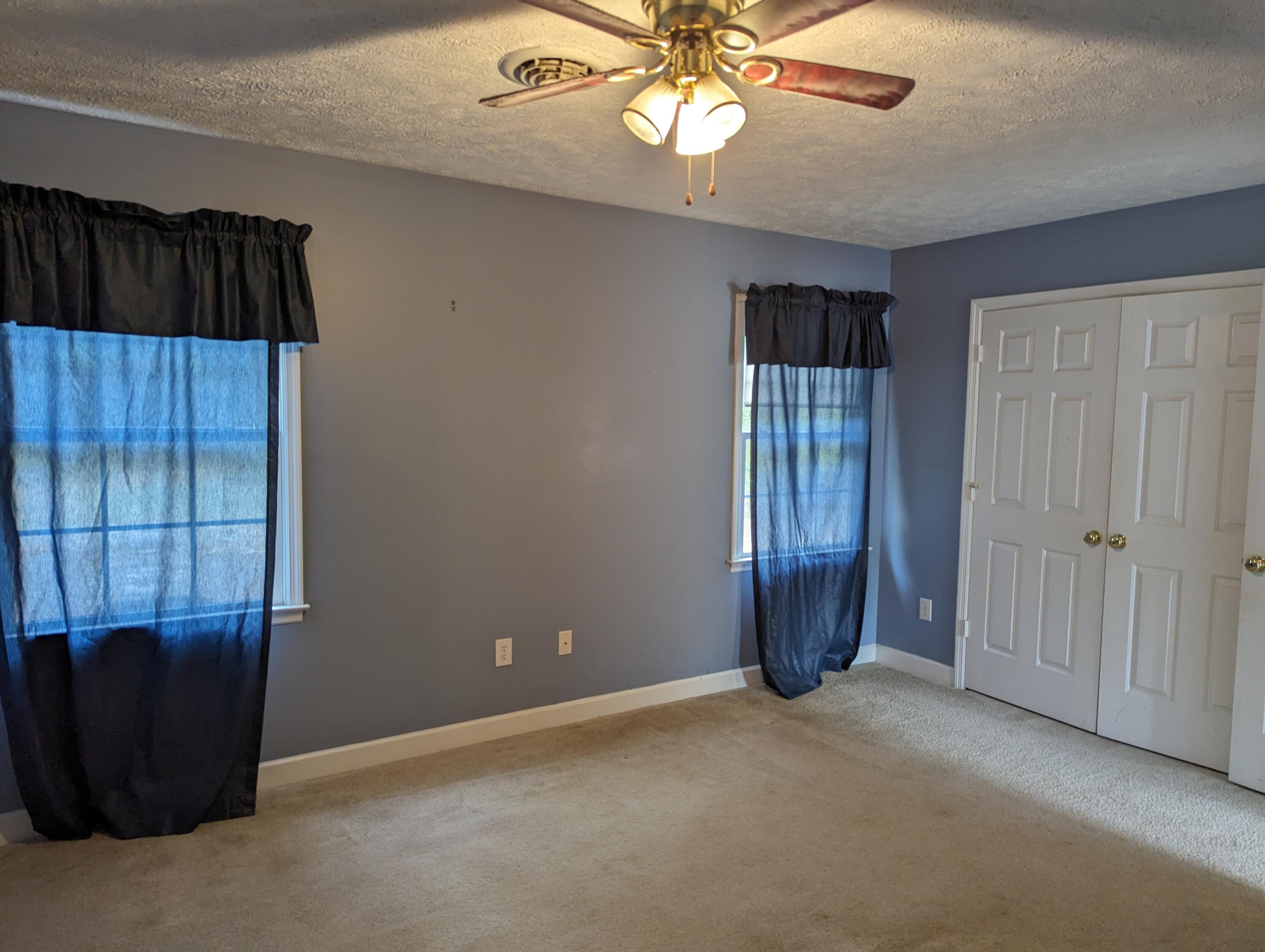4715 Providence Church Road Ferrum, VA 24088 - Photo 24 of 46 an empty room with windows and cabinet