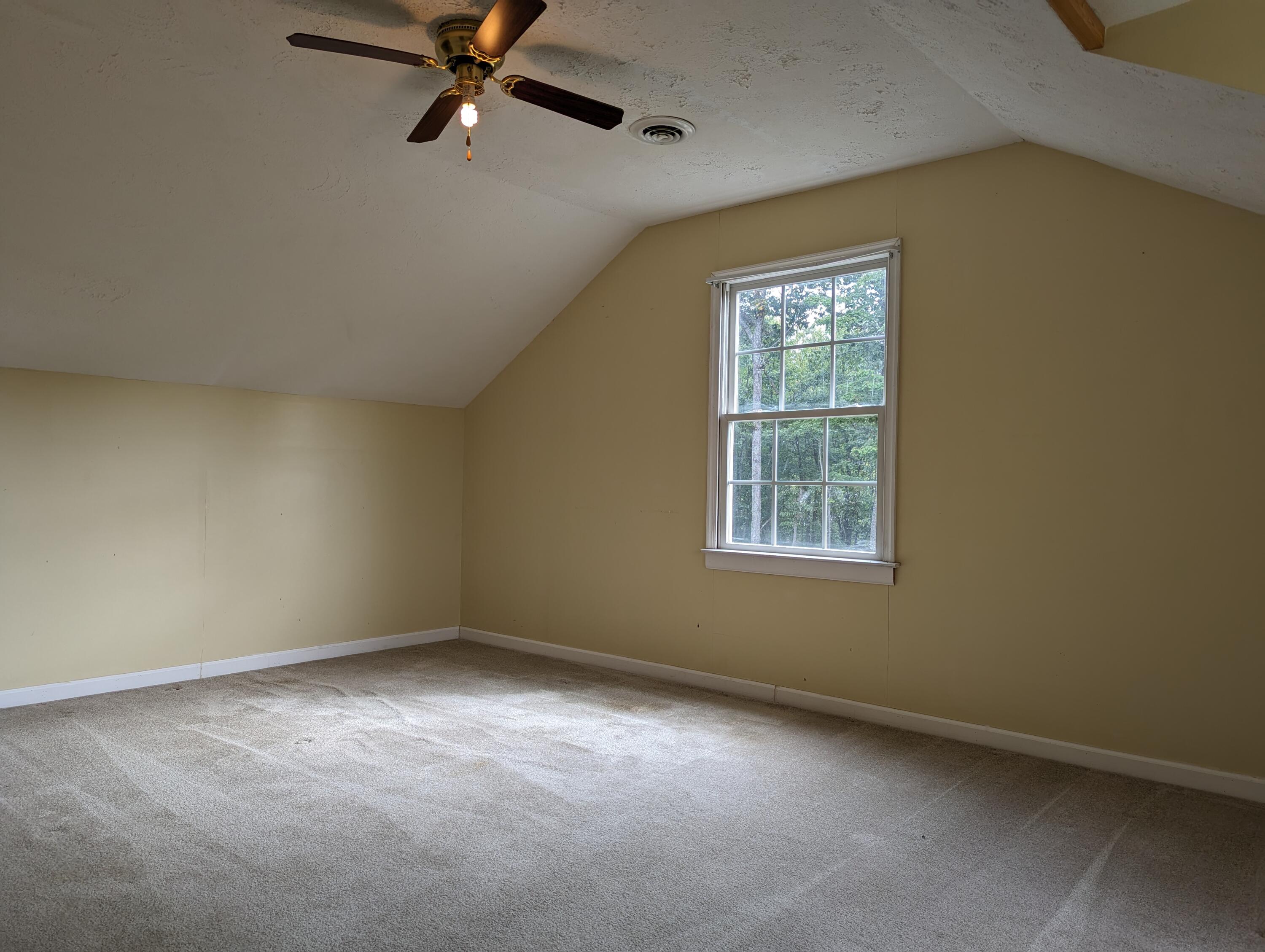 4715 Providence Church Road Ferrum, VA 24088 - Photo 28 of 46 an empty room with a window