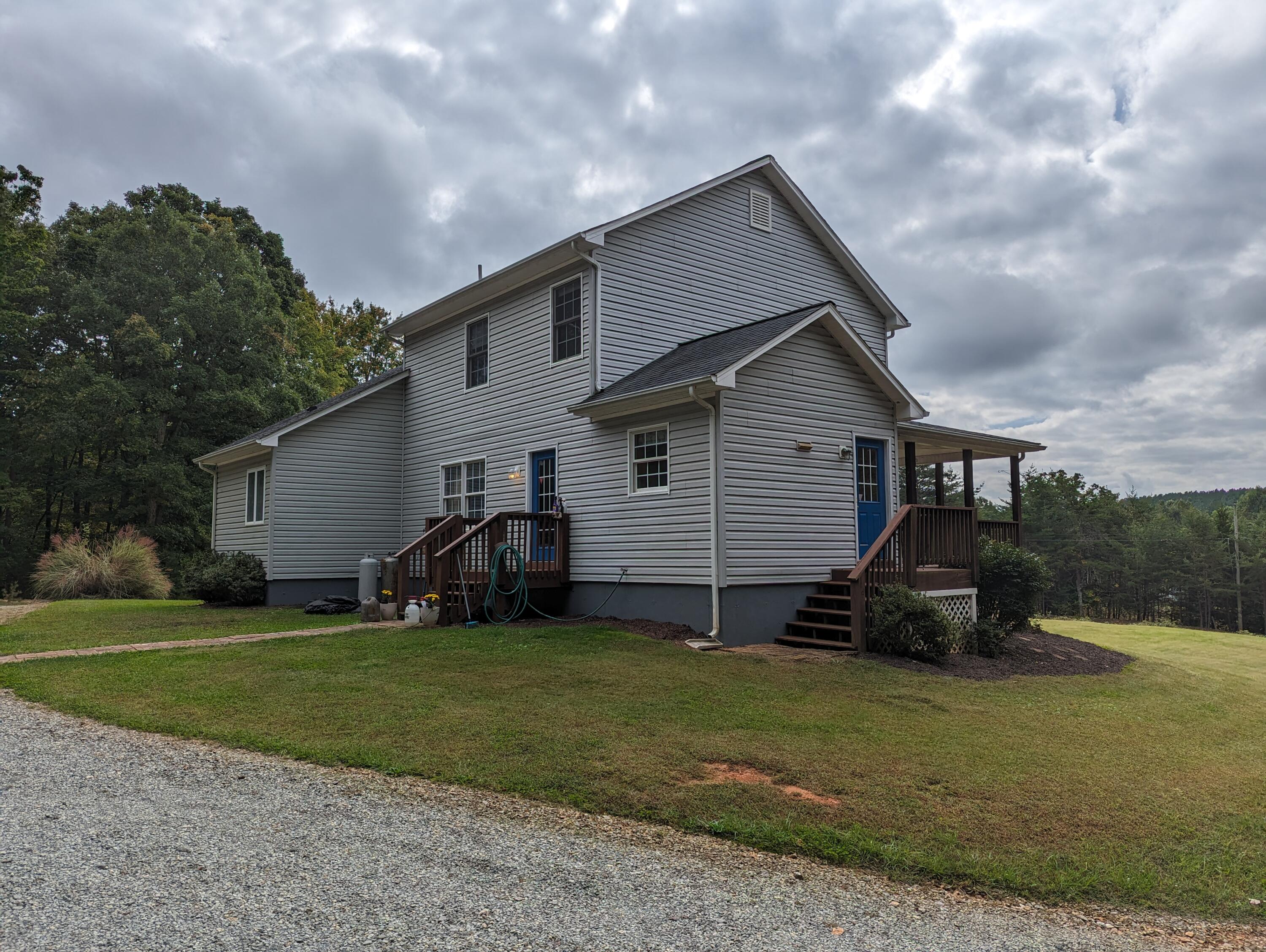 4715 Providence Church Road Ferrum, VA 24088 - Photo 34 of 46 a front view of a house with a garden