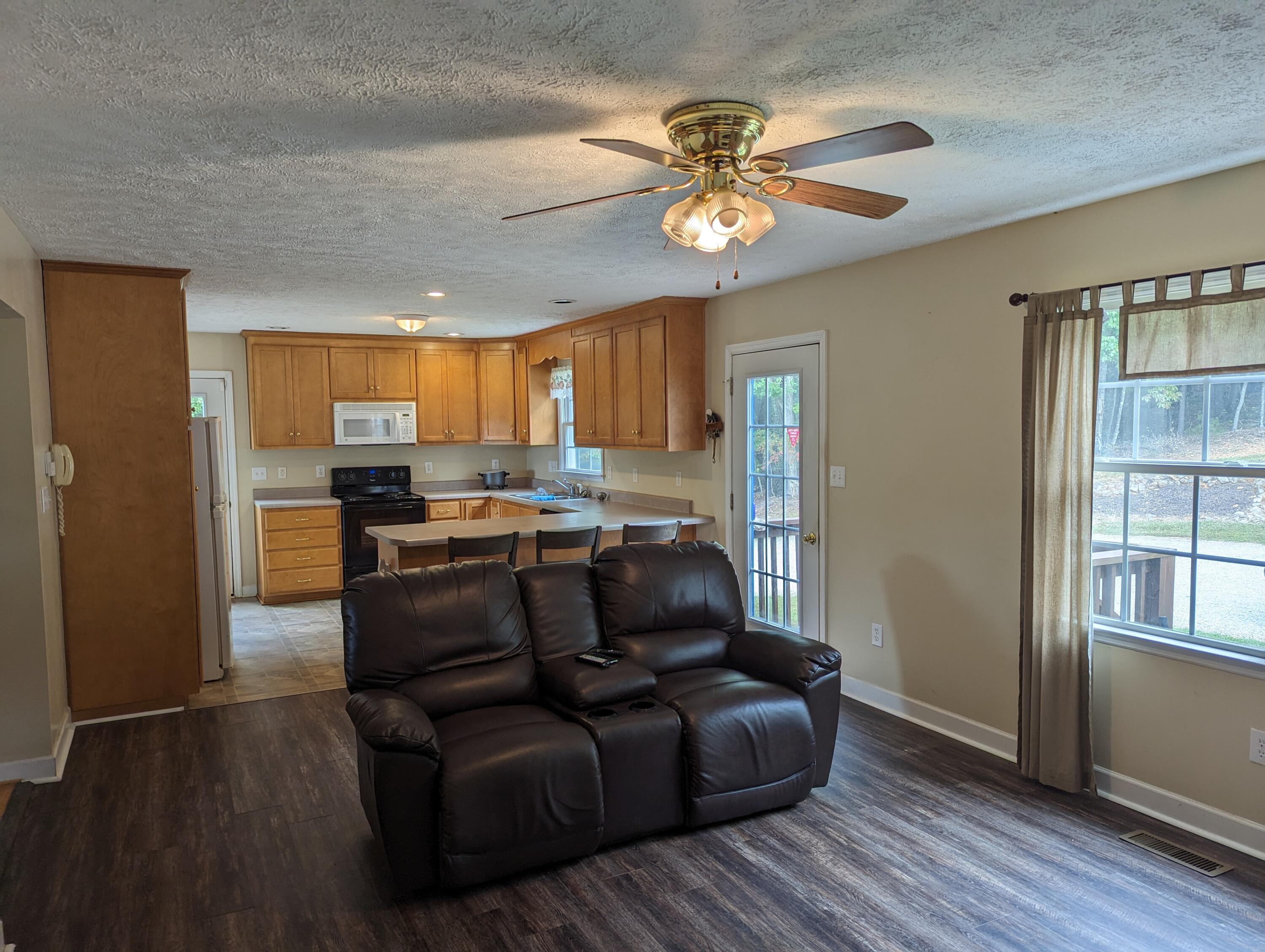 4715 Providence Church Road Ferrum, VA 24088 - Photo 8 of 46 a living room with stainless steel appliances granite countertop furniture and wooden floor