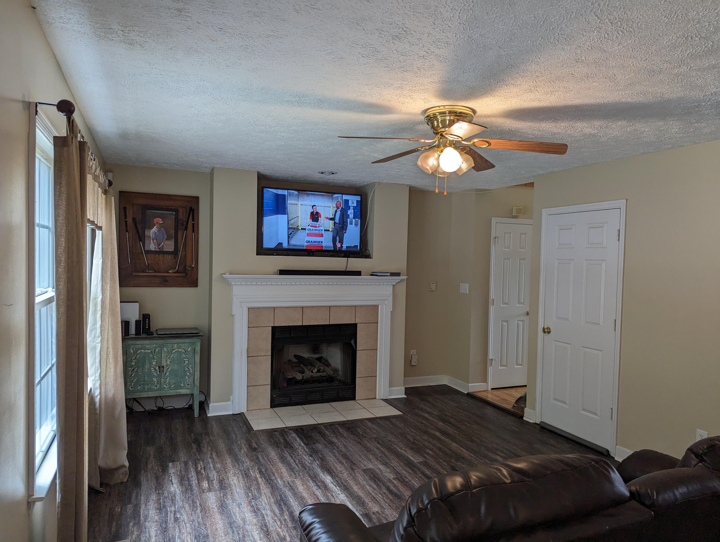 4715 Providence Church Road Ferrum, VA 24088 - Photo 10 of 46 a bedroom with a bed and a fireplace