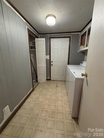 a view of a storage & utility room with a sink
