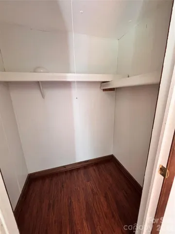 a view of an empty walk in closet