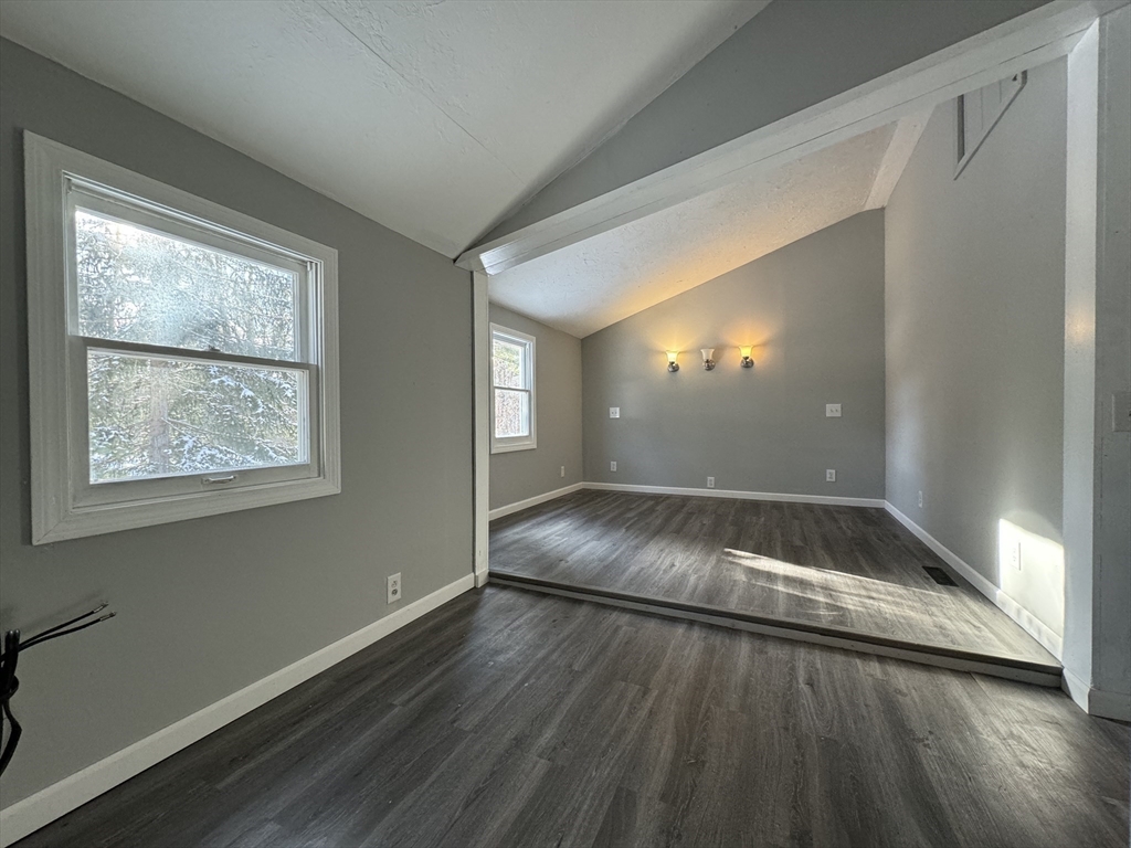 16 Schoolhouse Cross Road Brookfield, MA 01506 - Photo 11 of 39 a view of an empty room with wooden floor and a window