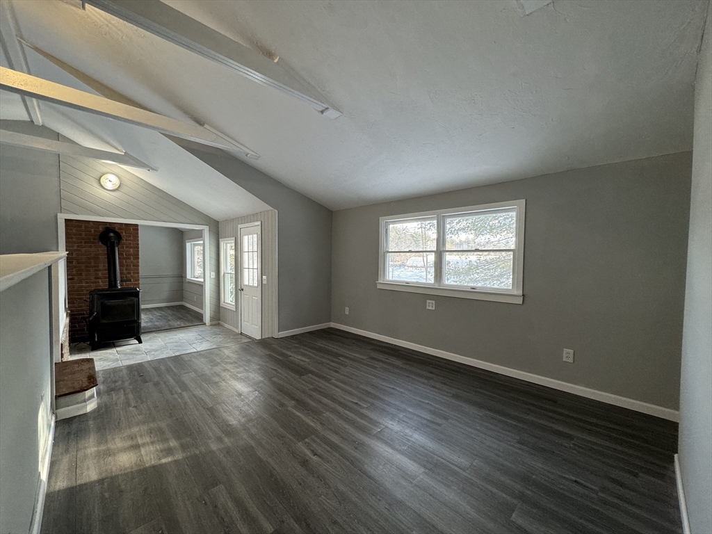 16 Schoolhouse Cross Road Brookfield, MA 01506 - Photo 19 of 39 wooden floor in an empty room with a window