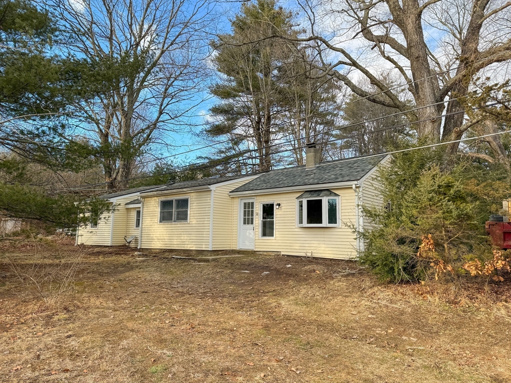 16 Schoolhouse Cross Road Brookfield, MA 01506 - Photo 2 of 39 front view of house with a yard