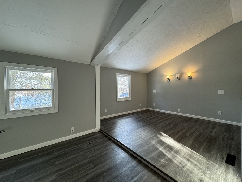 16 Schoolhouse Cross Road Brookfield, MA 01506 - Photo 21 of 39 an empty room with wooden floor and windows