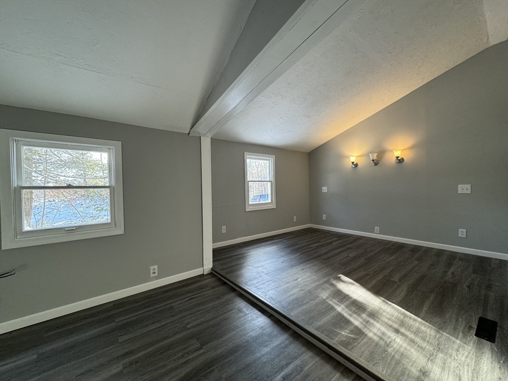 16 Schoolhouse Cross Road Brookfield, MA 01506 - Photo 23 of 39 an empty room with wooden floor and windows