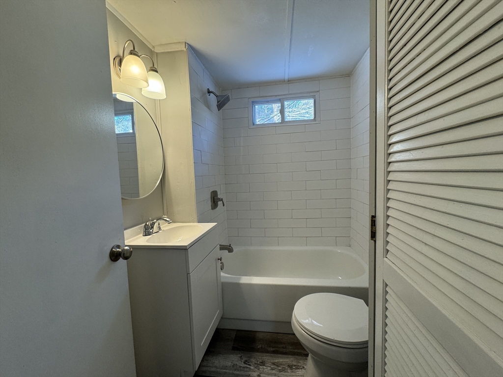 16 Schoolhouse Cross Road Brookfield, MA 01506 - Photo 29 of 39 a bathroom with a toilet a sink and mirror