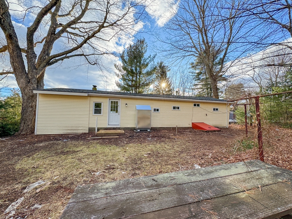 16 Schoolhouse Cross Road Brookfield, MA 01506 - Photo 37 of 39 a view of a house with a yard