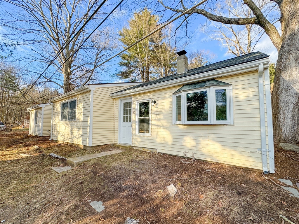 16 Schoolhouse Cross Road Brookfield, MA 01506 - Photo 39 of 39 a view of a house with a backyard