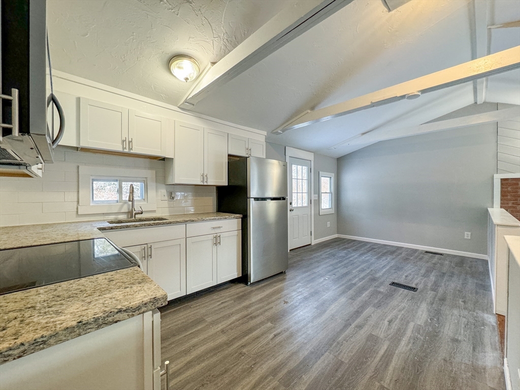 16 Schoolhouse Cross Road Brookfield, MA 01506 - Photo 6 of 39 a kitchen with granite countertop a refrigerator stove top oven and sink