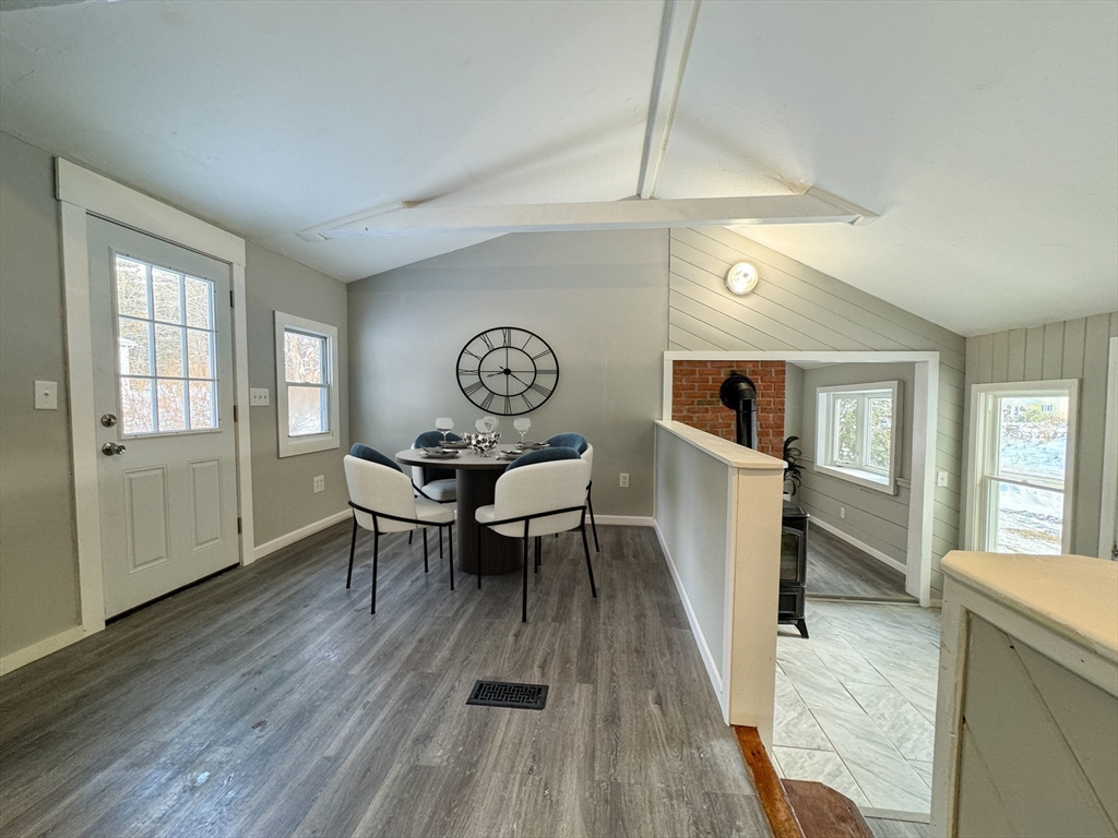 16 Schoolhouse Cross Road Brookfield, MA 01506 - Photo 10 of 39 a dining room with wooden floor and furniture