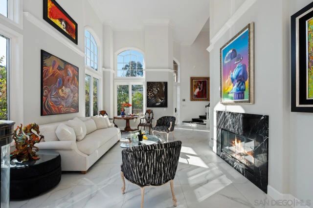 a living room with furniture floor and a flat screen tv