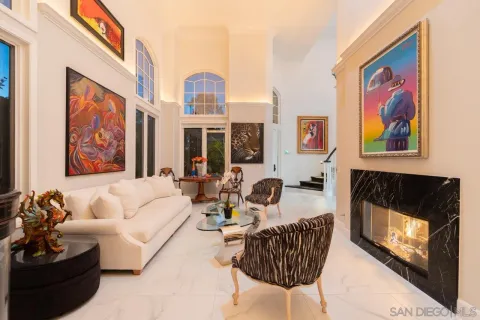 a living room with fireplace furniture and a flat screen tv