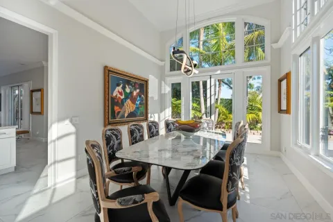a kitchen with stainless steel appliances granite countertop a sink refrigerator and cabinets