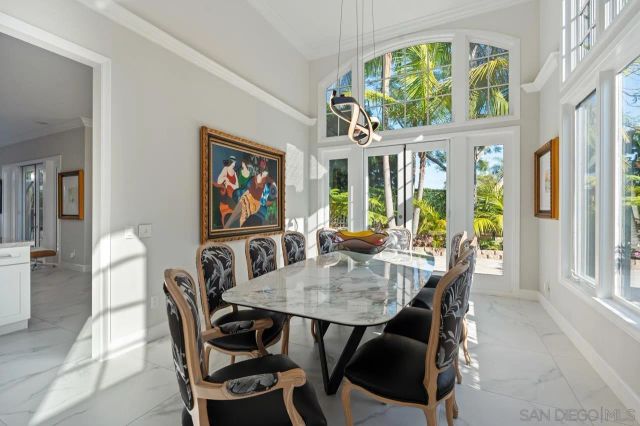 a kitchen with stainless steel appliances granite countertop a sink refrigerator and cabinets