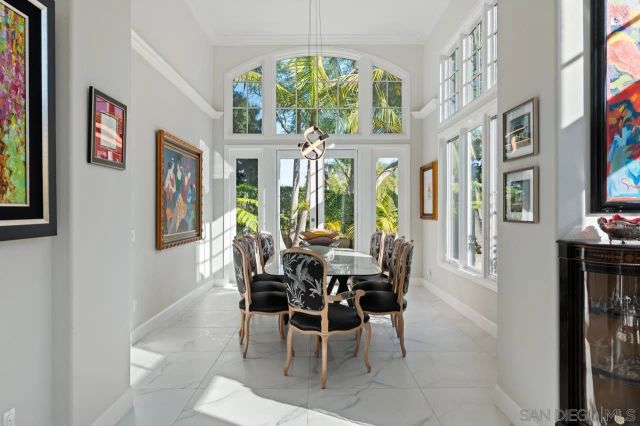 a kitchen with stainless steel appliances granite countertop a stove and white cabinets