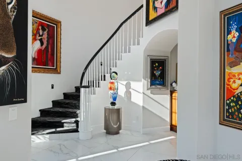 a living room with furniture a rug and a fireplace