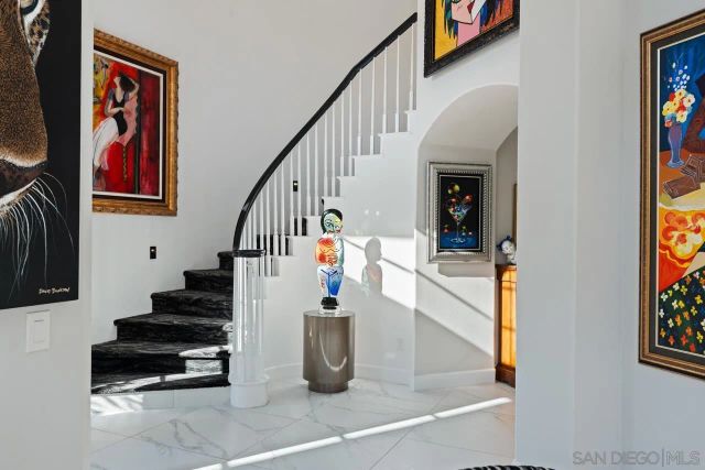a living room with furniture a rug and a fireplace