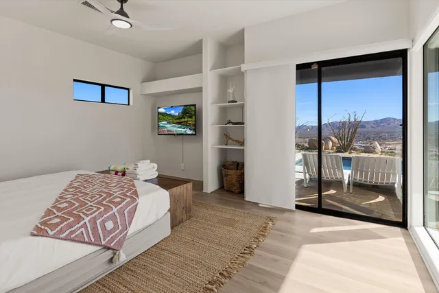 a bedroom with a bed and a mirror