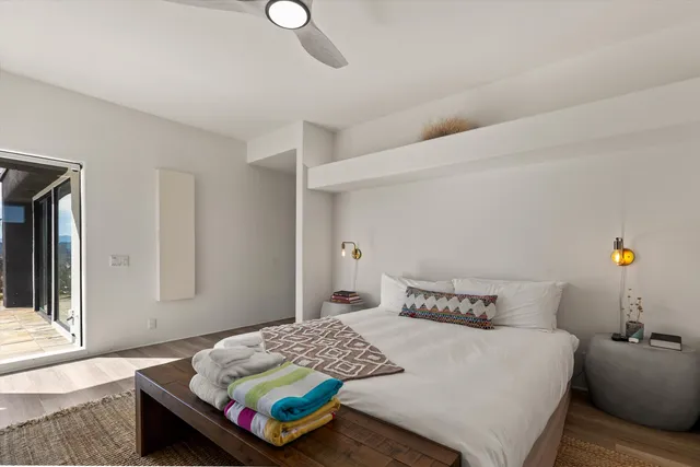 a bedroom with a bed and window