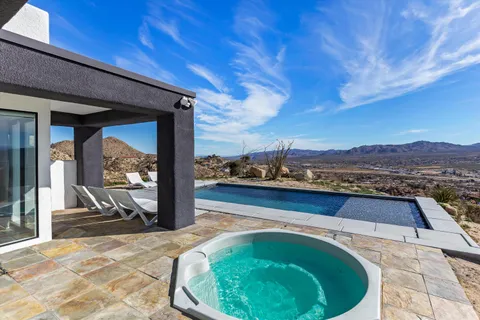 a view of swimming pool from a balcony