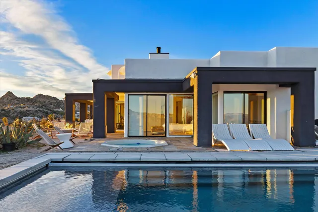 a living room with furniture pool table and chair