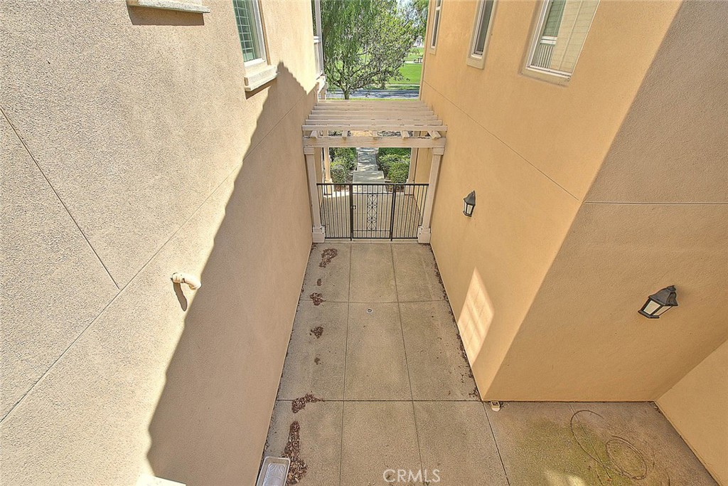 8150 West Preserve Loop Chino, CA 91708 - Photo 13 of 51 a view of a hallway with wooden floor and dining room