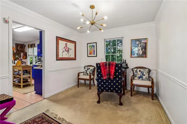 a bedroom with furniture and a chandelier
