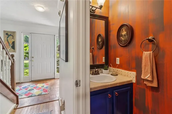 a bathroom with a sink and a mirror