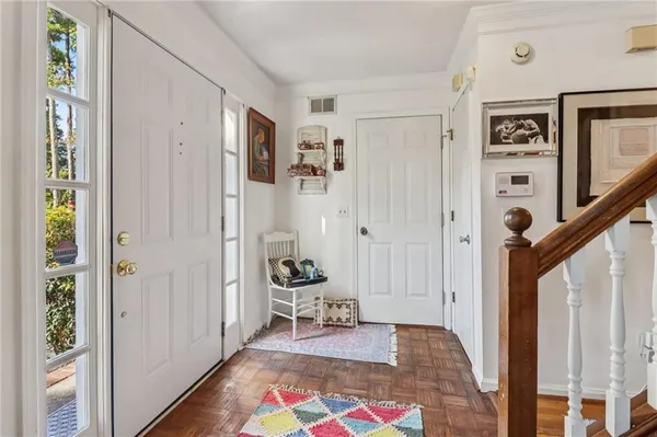 a room with furniture and a rug