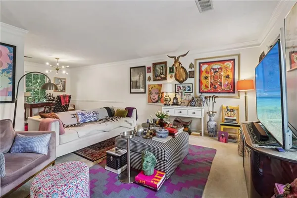 a living room with furniture fireplace and flat screen tv