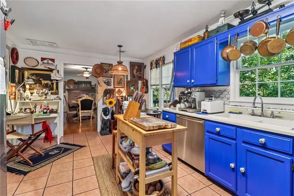 a kitchen with lots of appliances and cabinets