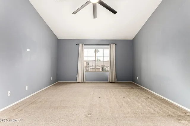 a view of a livingroom with a chandelier fan