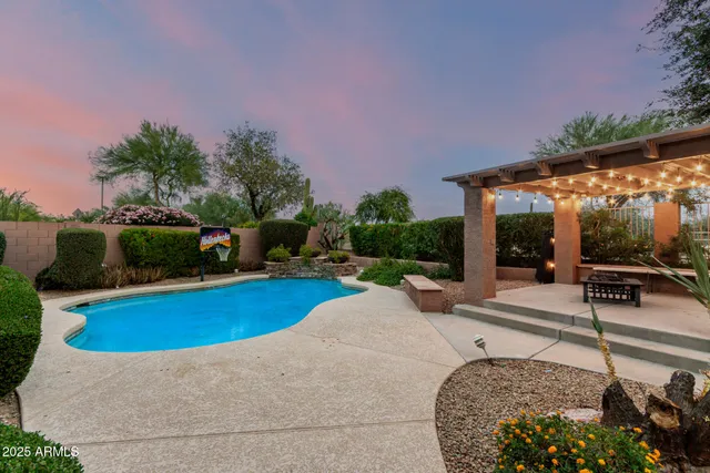 a view of a house with swimming pool and porch