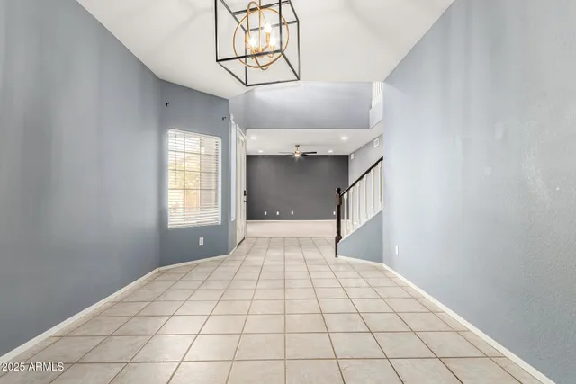 a view of entryway with stairs and wooden floor