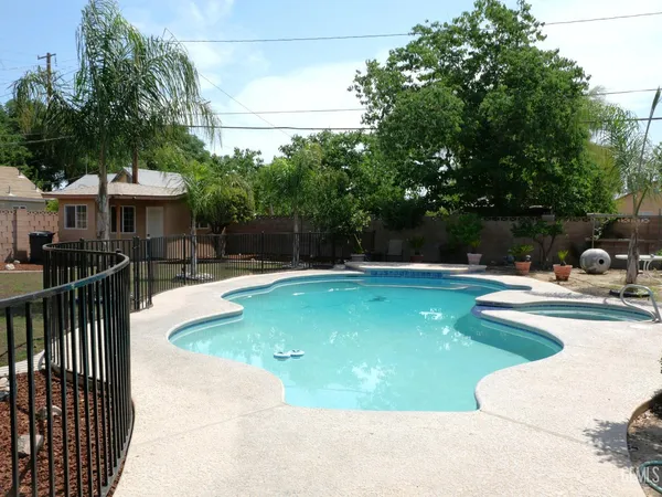 a view of a swimming pool with a patio