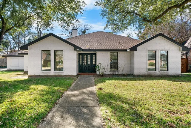 a house view with a garden space