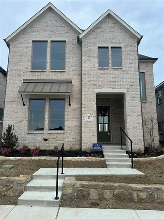 a front view of a house with garage and door