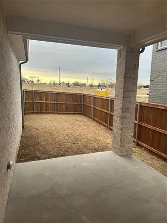 a view of an empty room with windows
