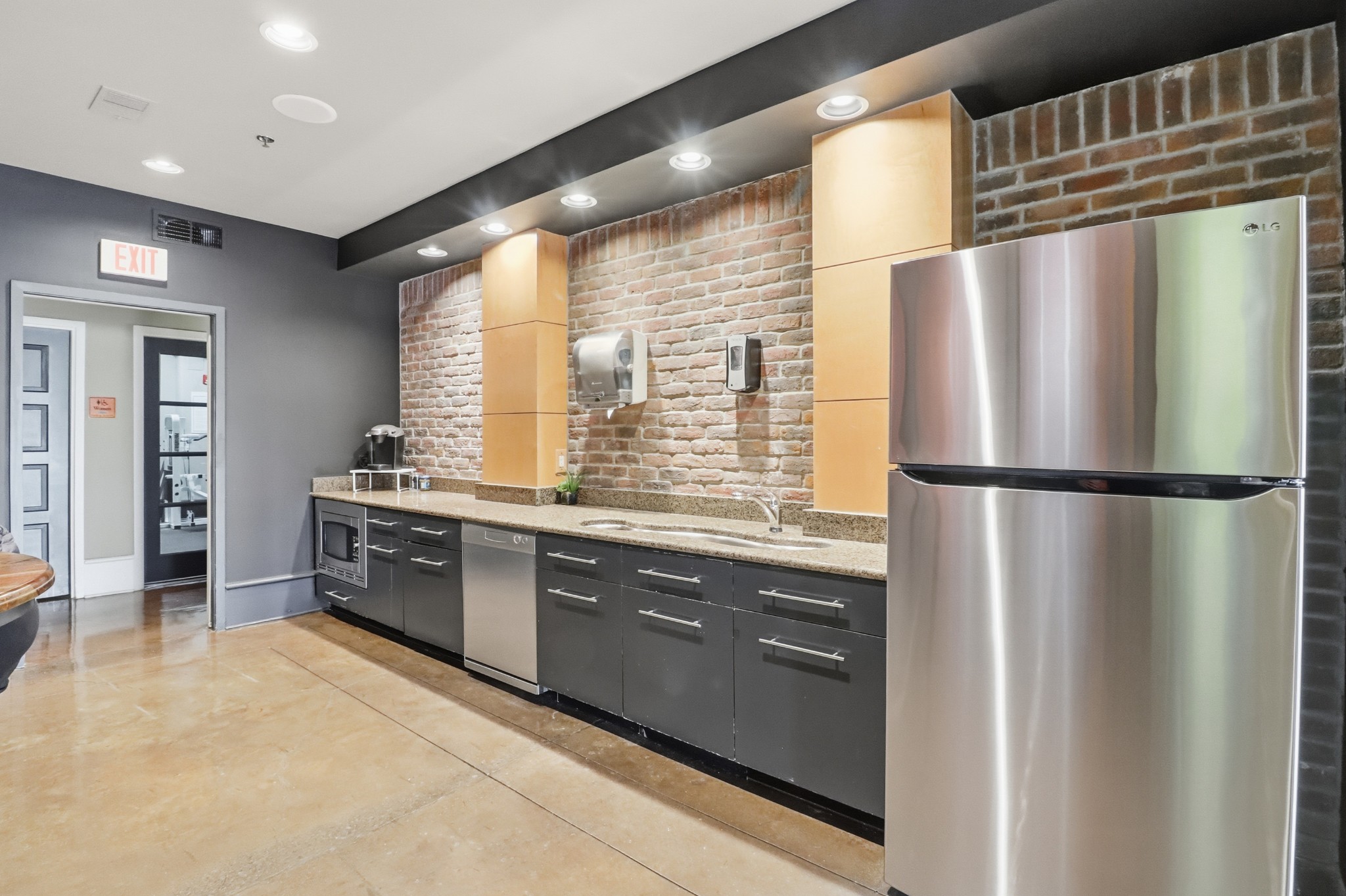 1803 Broadway, Unit 519 Nashville, TN 37203 - Photo 25 of 31 a kitchen with stainless steel appliances granite countertop a refrigerator and a sink