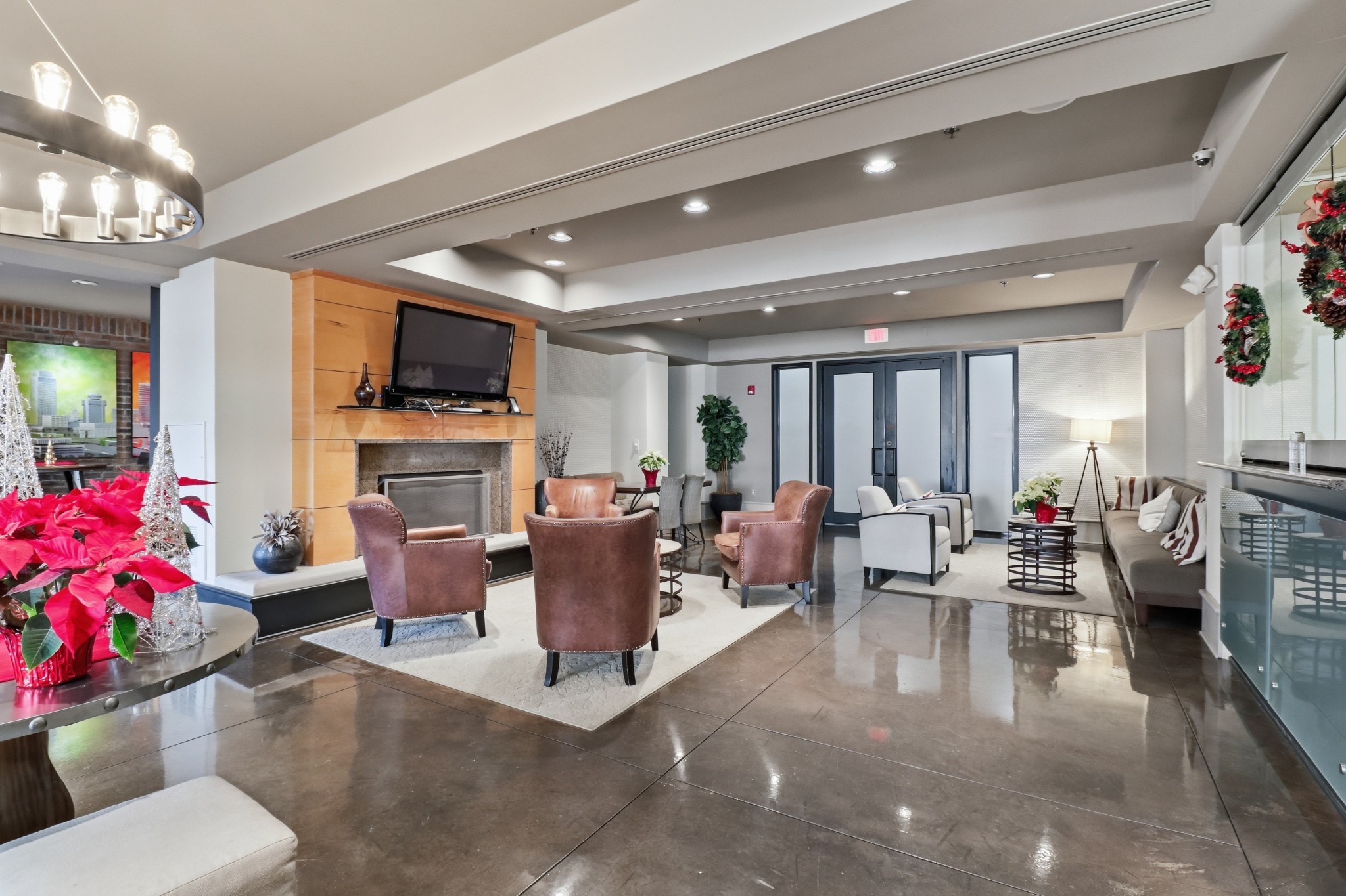 1803 Broadway, Unit 519 Nashville, TN 37203 - Photo 27 of 31 a living room with fireplace furniture and a flat screen tv