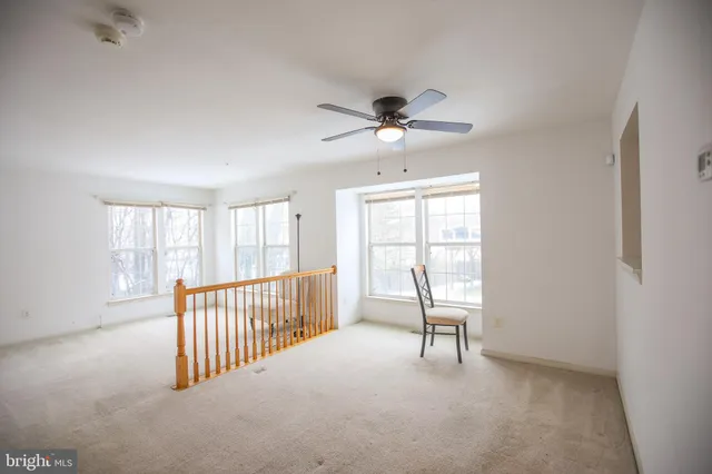 a view of a livingroom with a furniture and a window