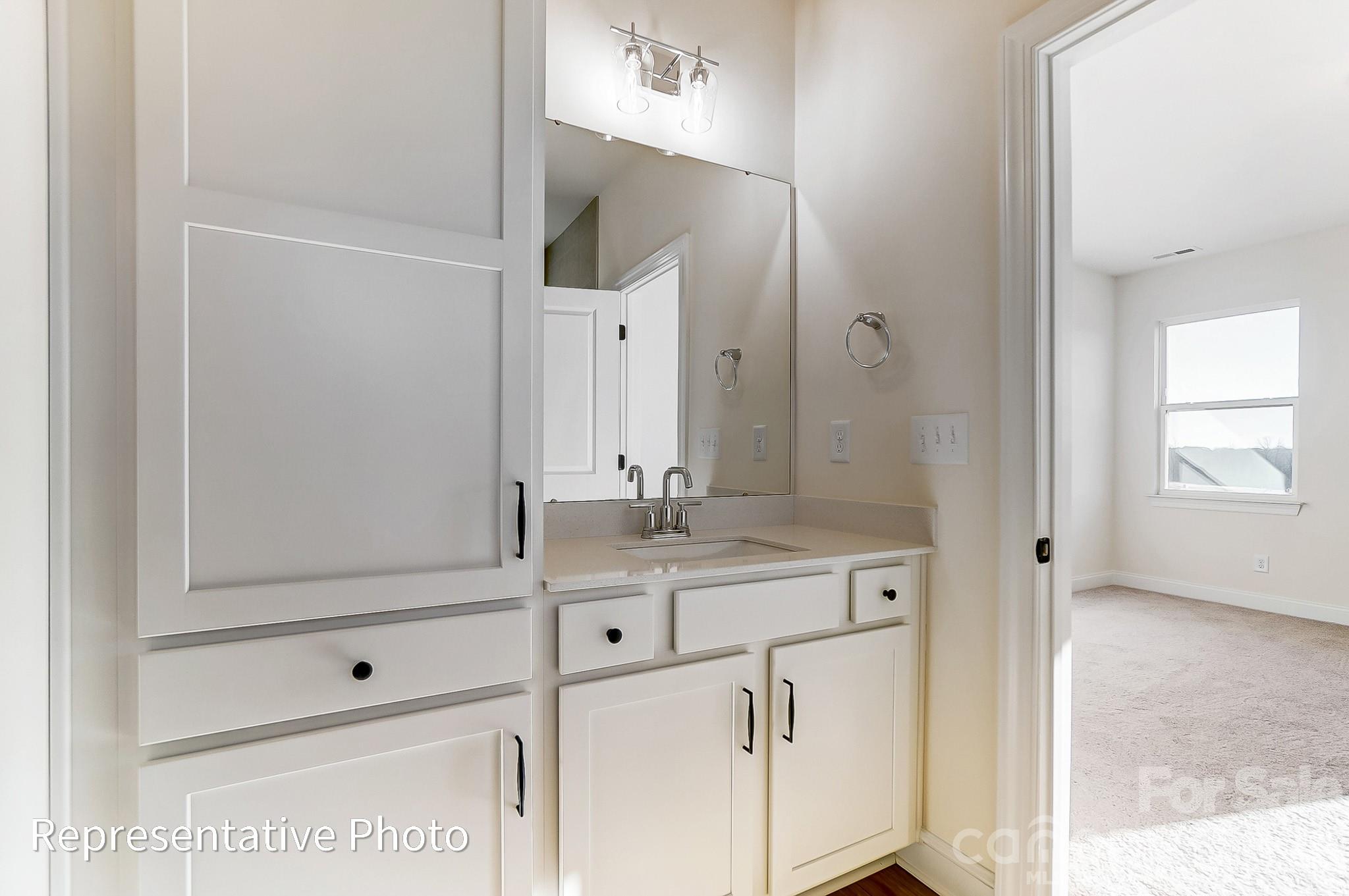 5009 Raging Crk Drive Indian Trail, NC 28079 - Photo 13 of 39 a bathroom with a sink vanity granite and a mirror