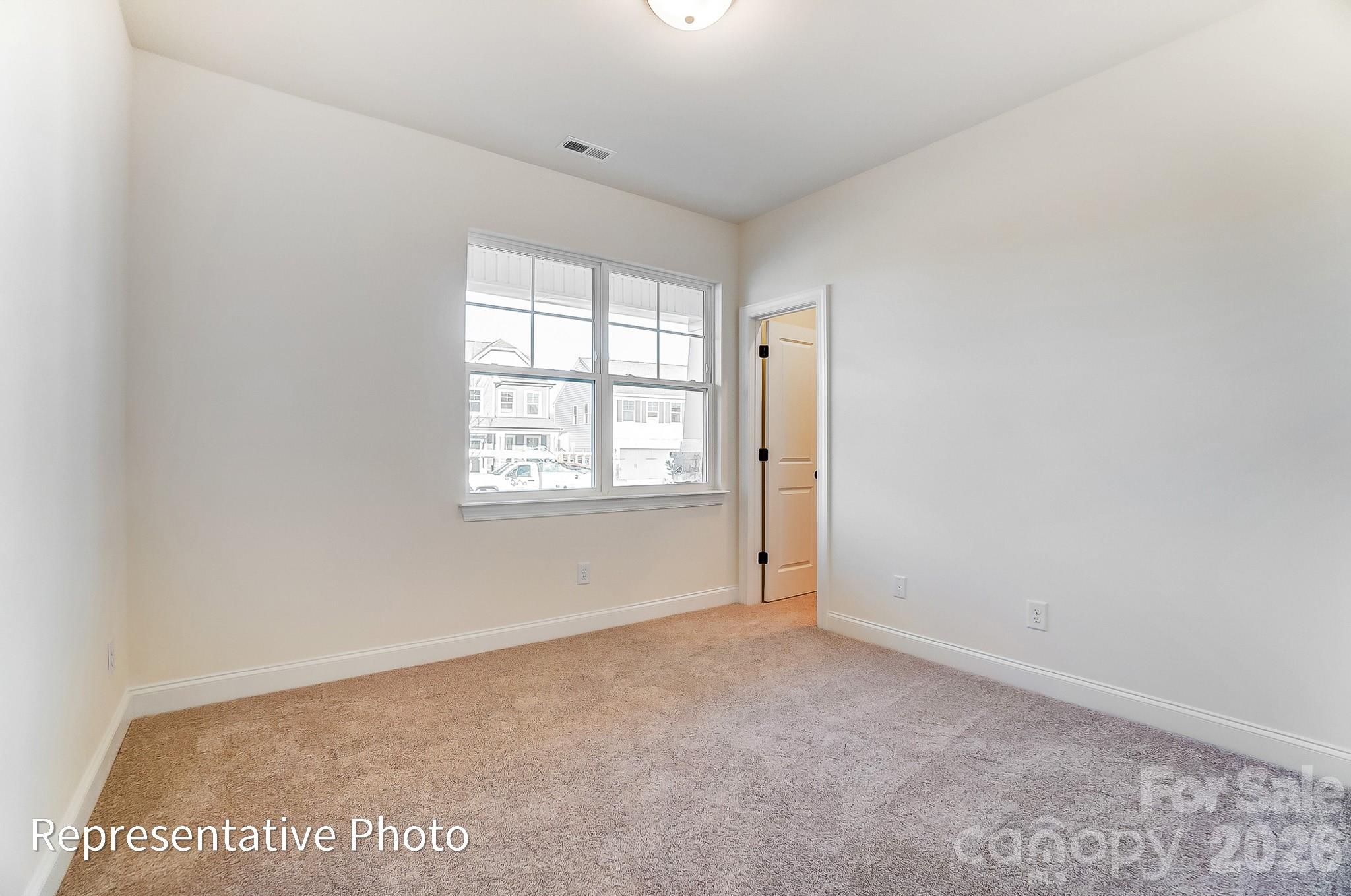 5009 Raging Crk Drive Indian Trail, NC 28079 - Photo 18 of 39 an empty room with windows